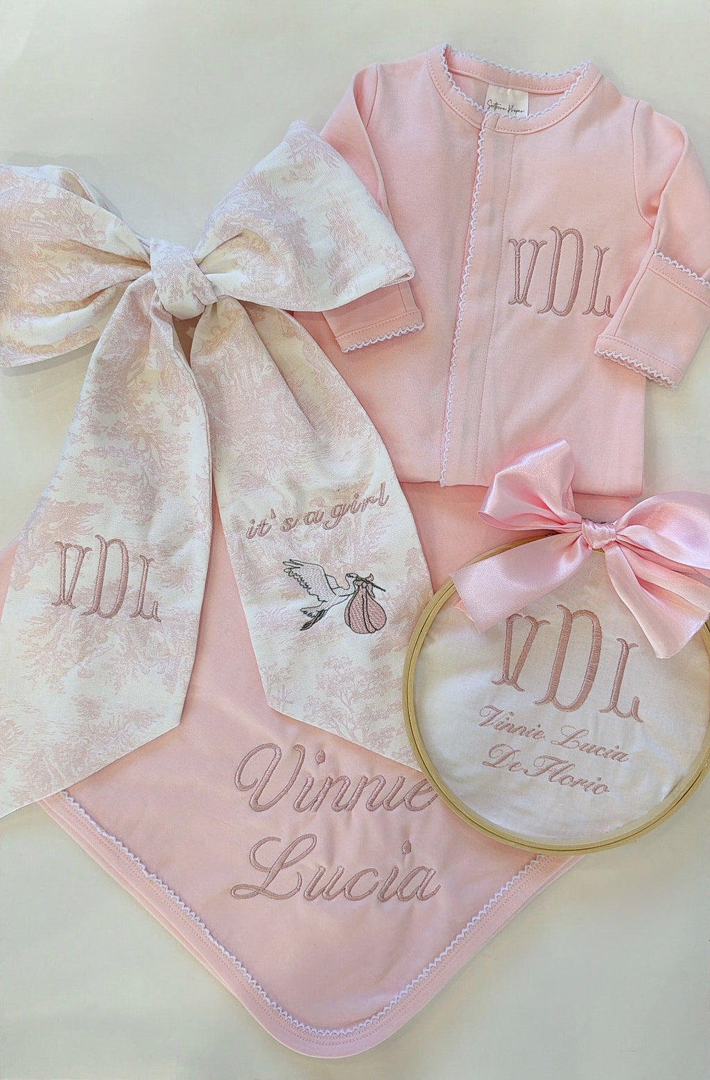 Pink onesie with white picot trim