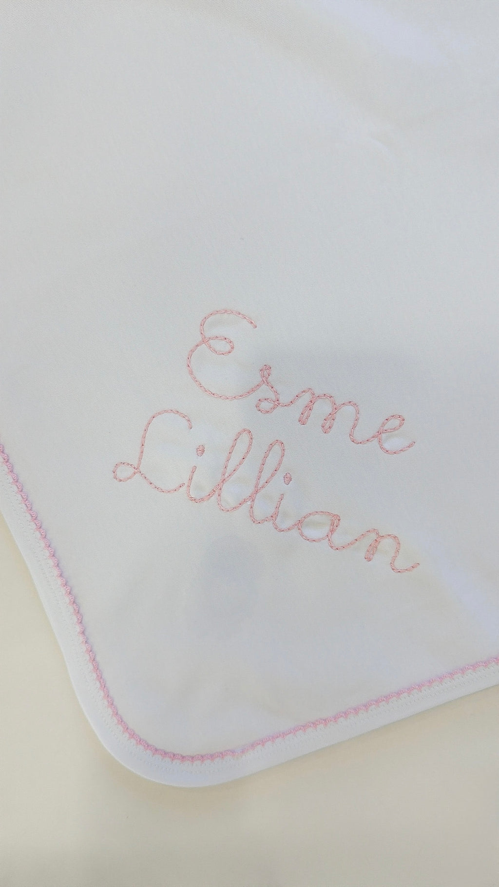 White blanket with pink picot trim