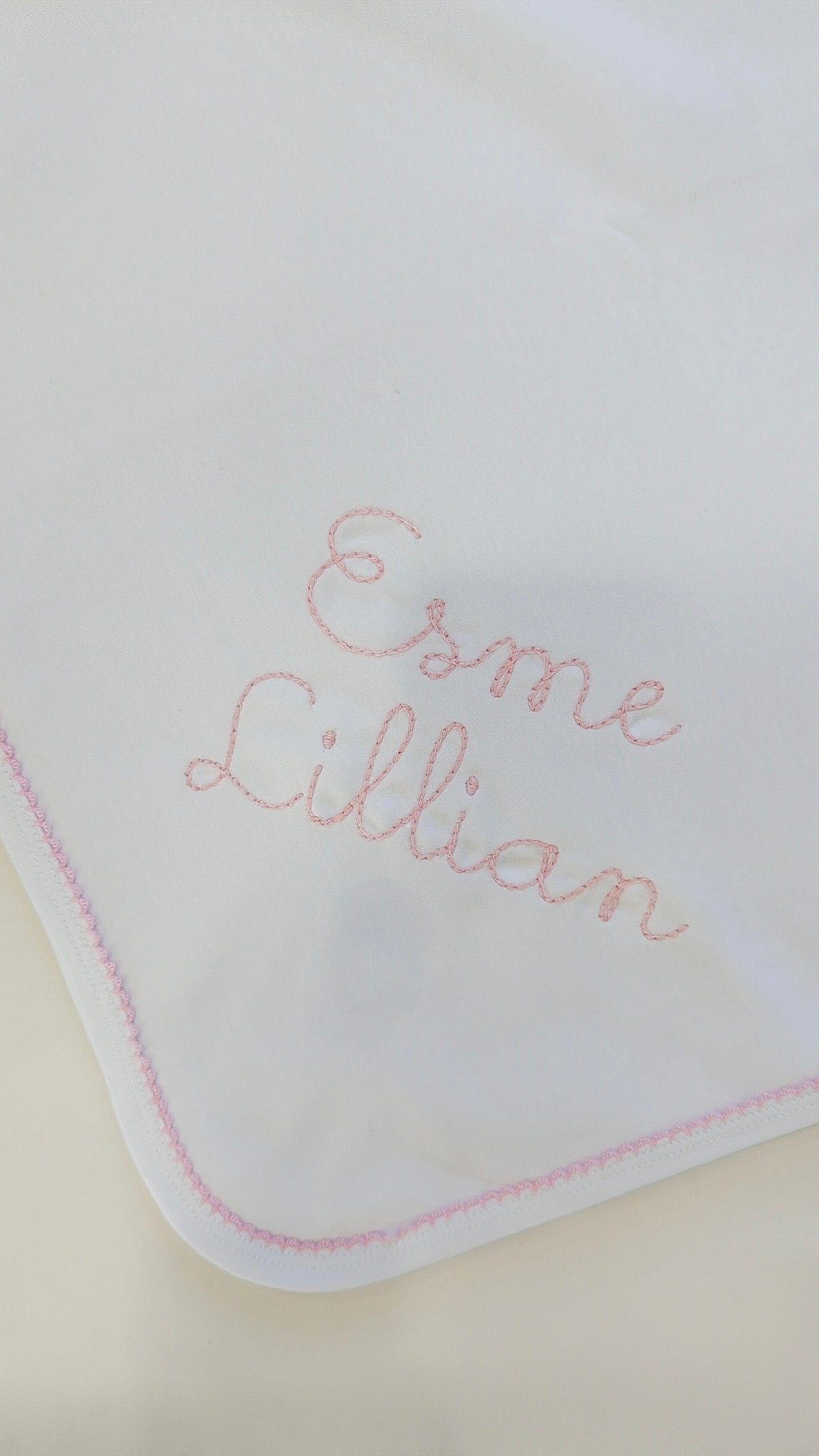 White blanket with pink picot trim