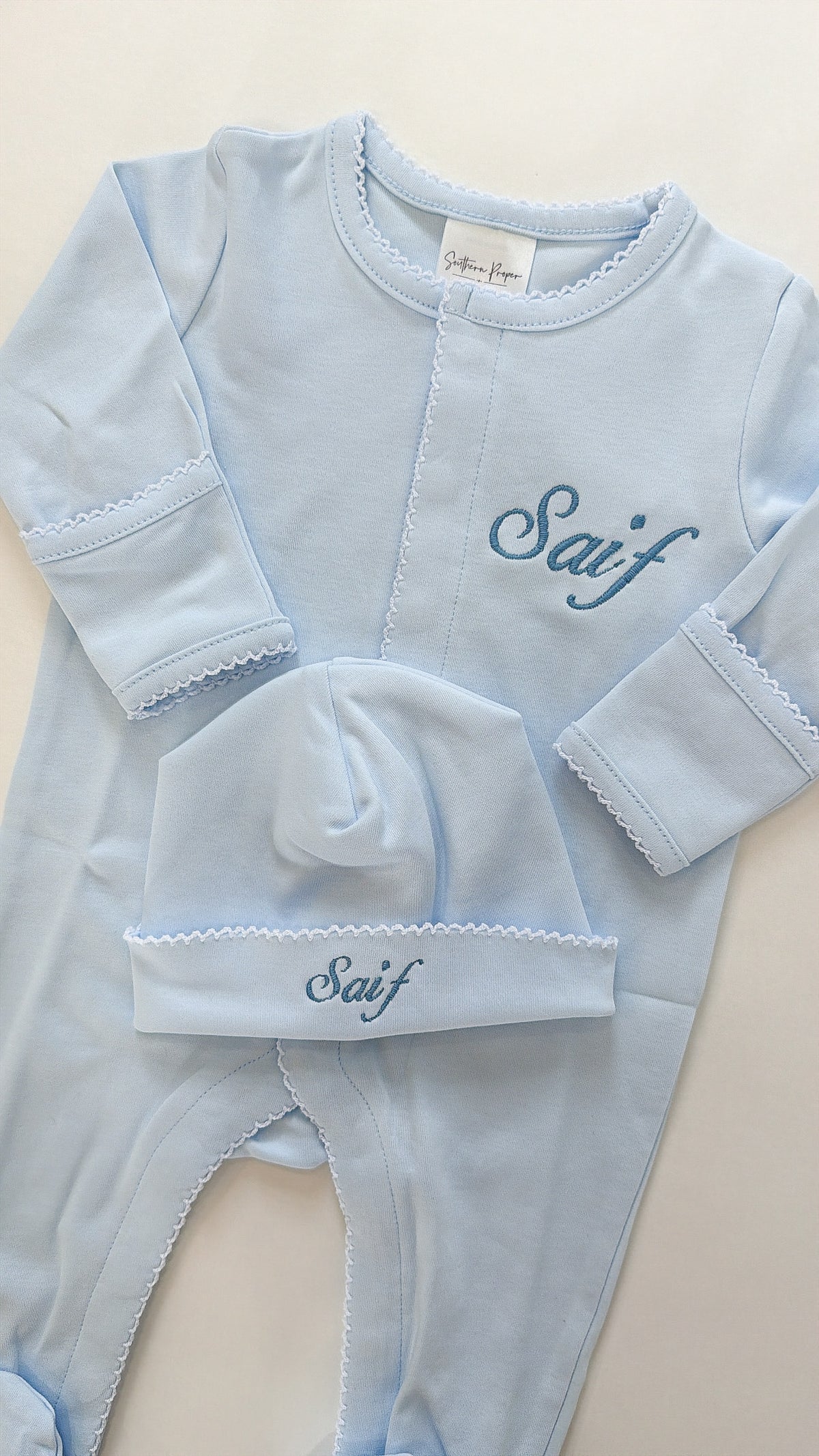 Blue oneise with white picot trim